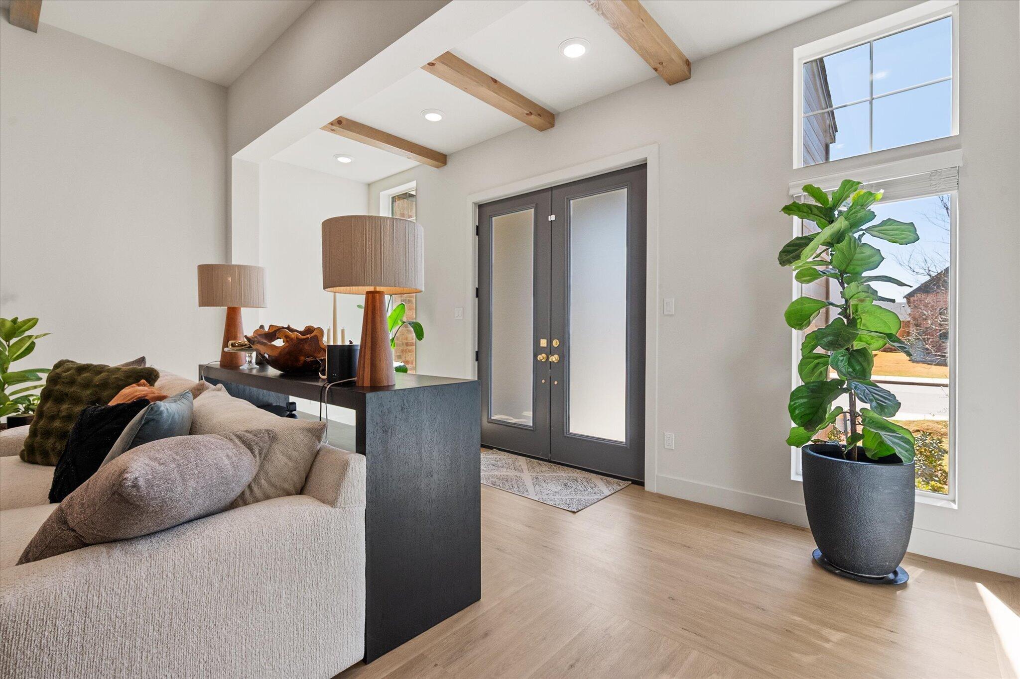 4026 136th Street Lubbock, TX 79423 - Photo 4 of 40 a living room with furniture and a potted plant