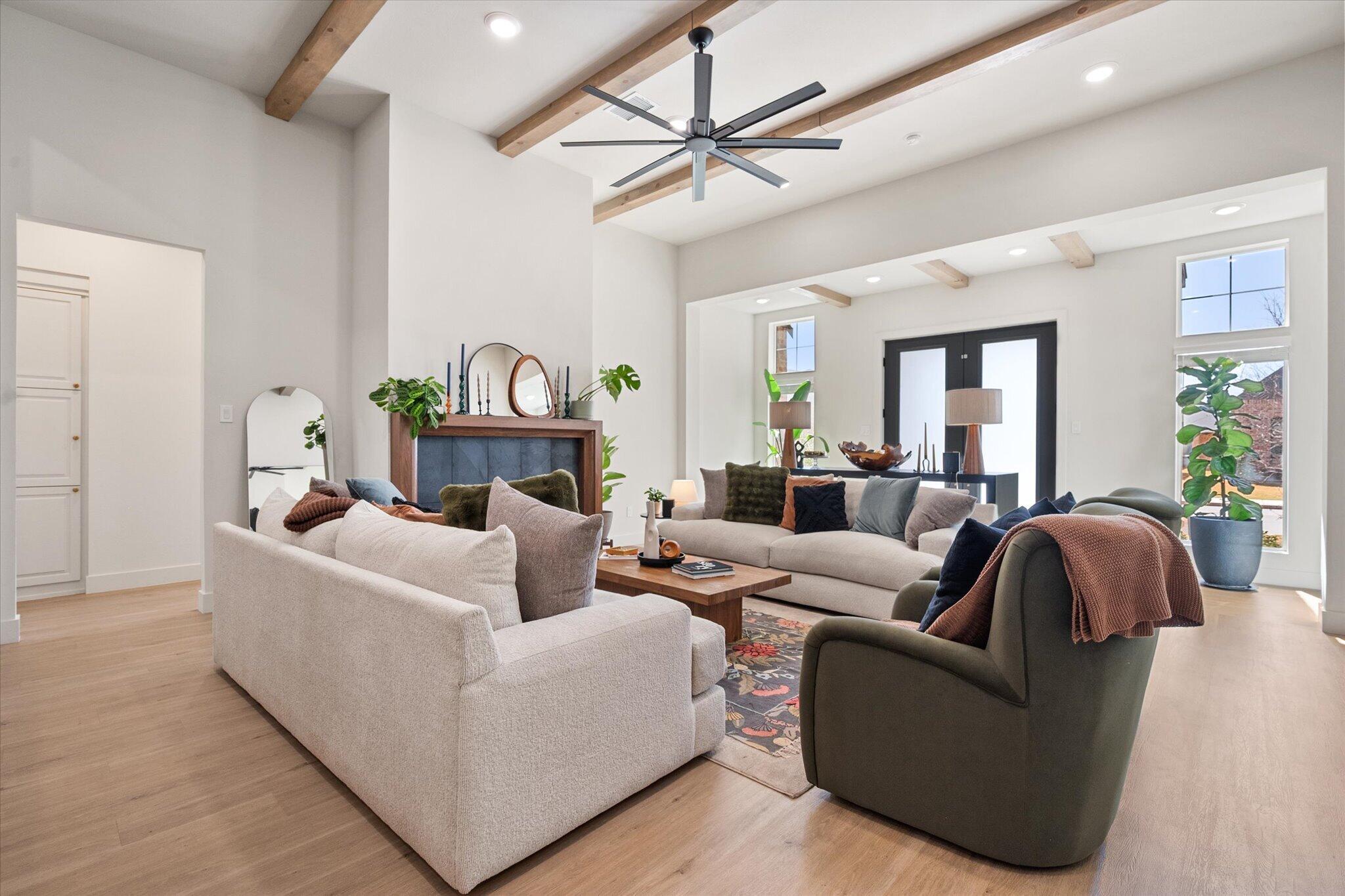 4026 136th Street Lubbock, TX 79423 - Photo 6 of 40 a living room with furniture and a wooden floor