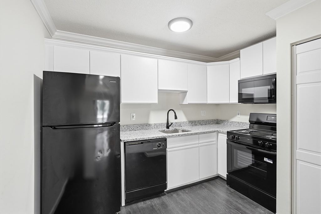 30 Abbey Road, Unit 102 Leominster, MA 01453 - Photo 7 of 15 a kitchen with a refrigerator stove and sink