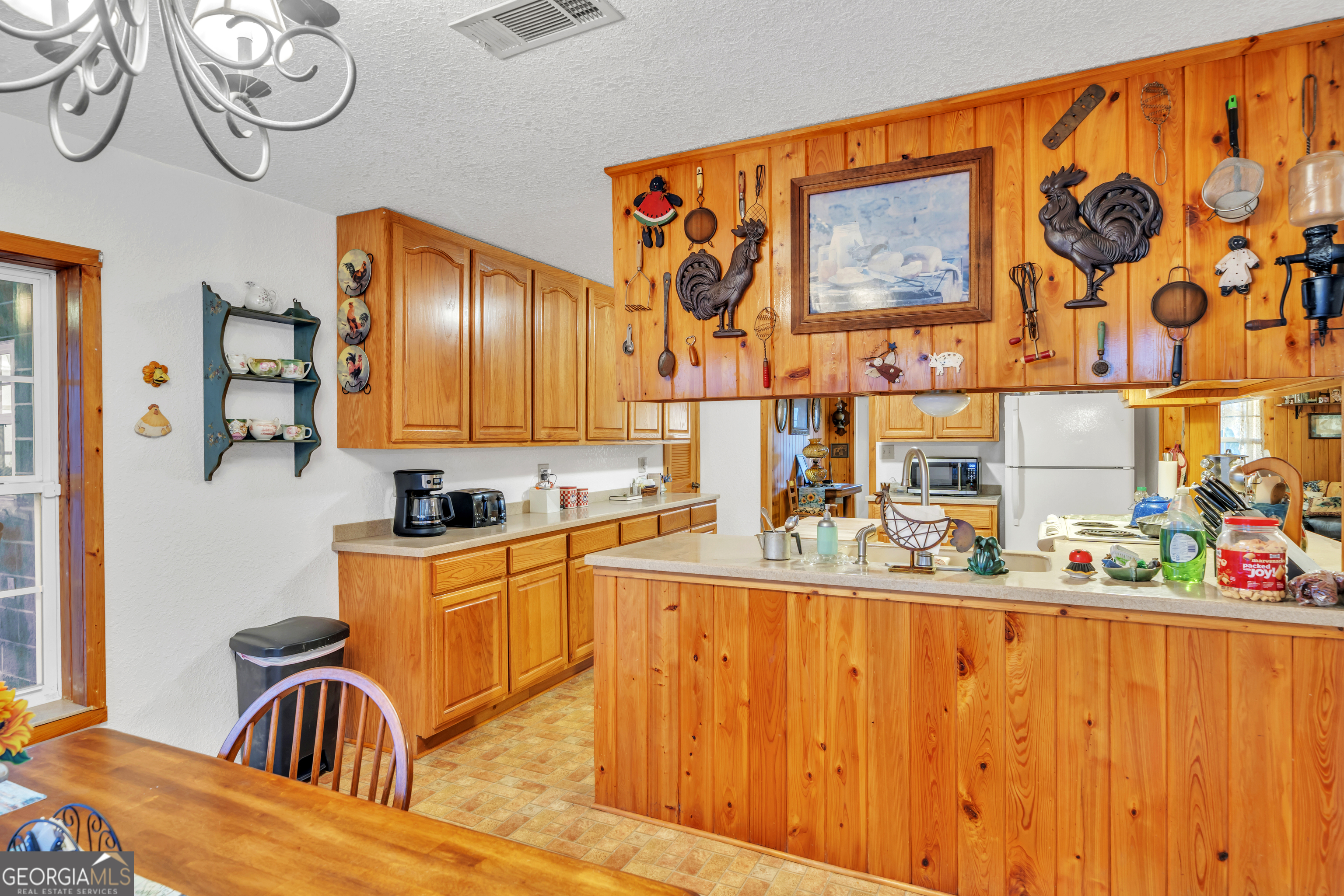 241 Foskey Cemetery Road Adrian, GA 31002 - Photo 26 of 95 a kitchen with stainless steel appliances granite countertop a sink and cabinets