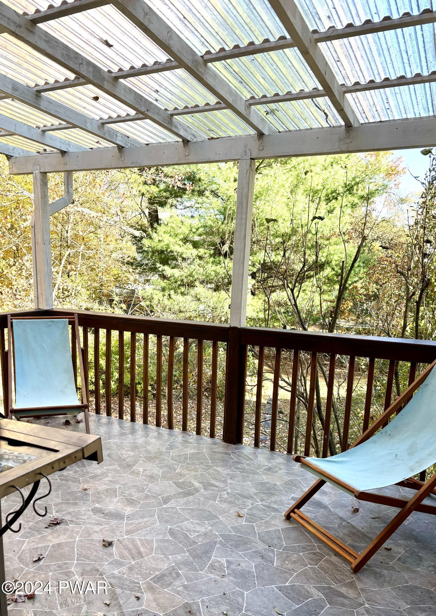 136 Stamford Road Dingmans Ferry, PA 18328 - Photo 43 of 52 a view of a balcony with chairs