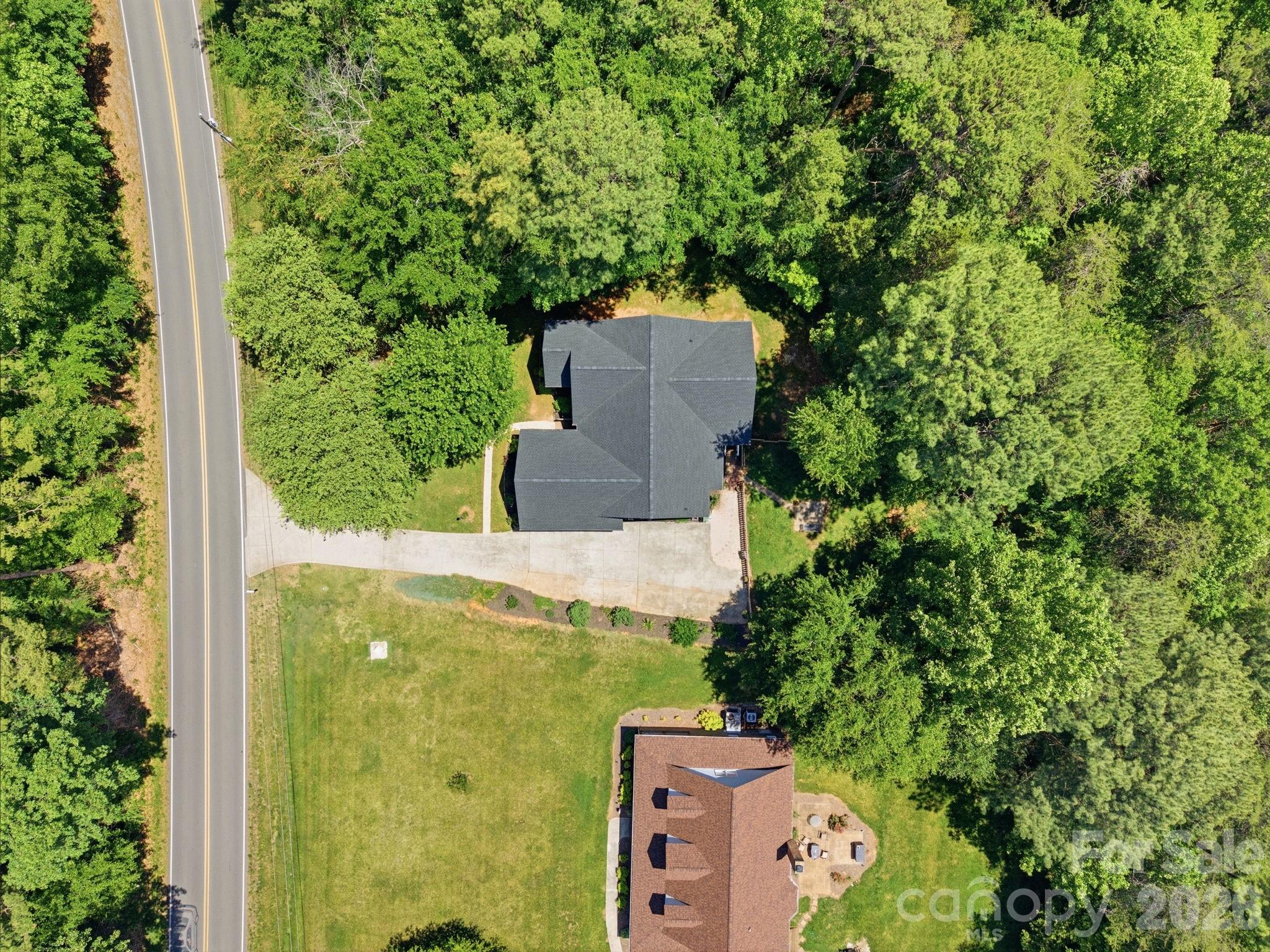 145 Upper Spencer Mountain Road Stanley, NC 28164 - Photo 2 of 29 an aerial view of a house with a yard
