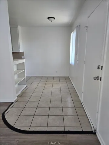 a view of wooden floor in an empty room