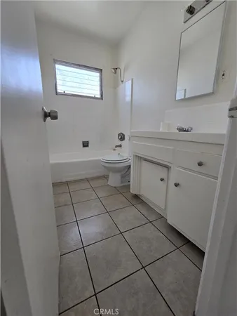 a view of a car park in front of house