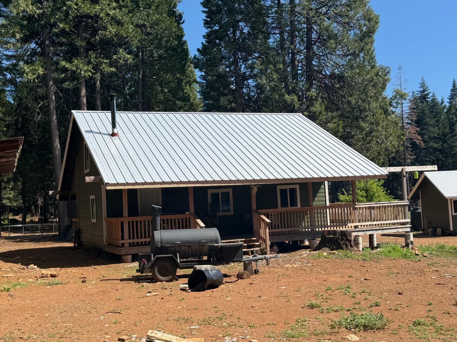14940 Chalk Bluff Road Nevada City, CA 95959 - Photo 2 of 29 a front view of a house with roof deck