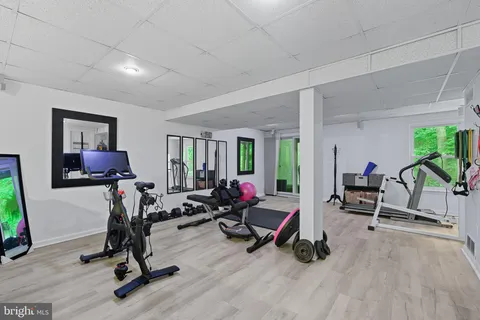 a view of a livingroom with gym equipment