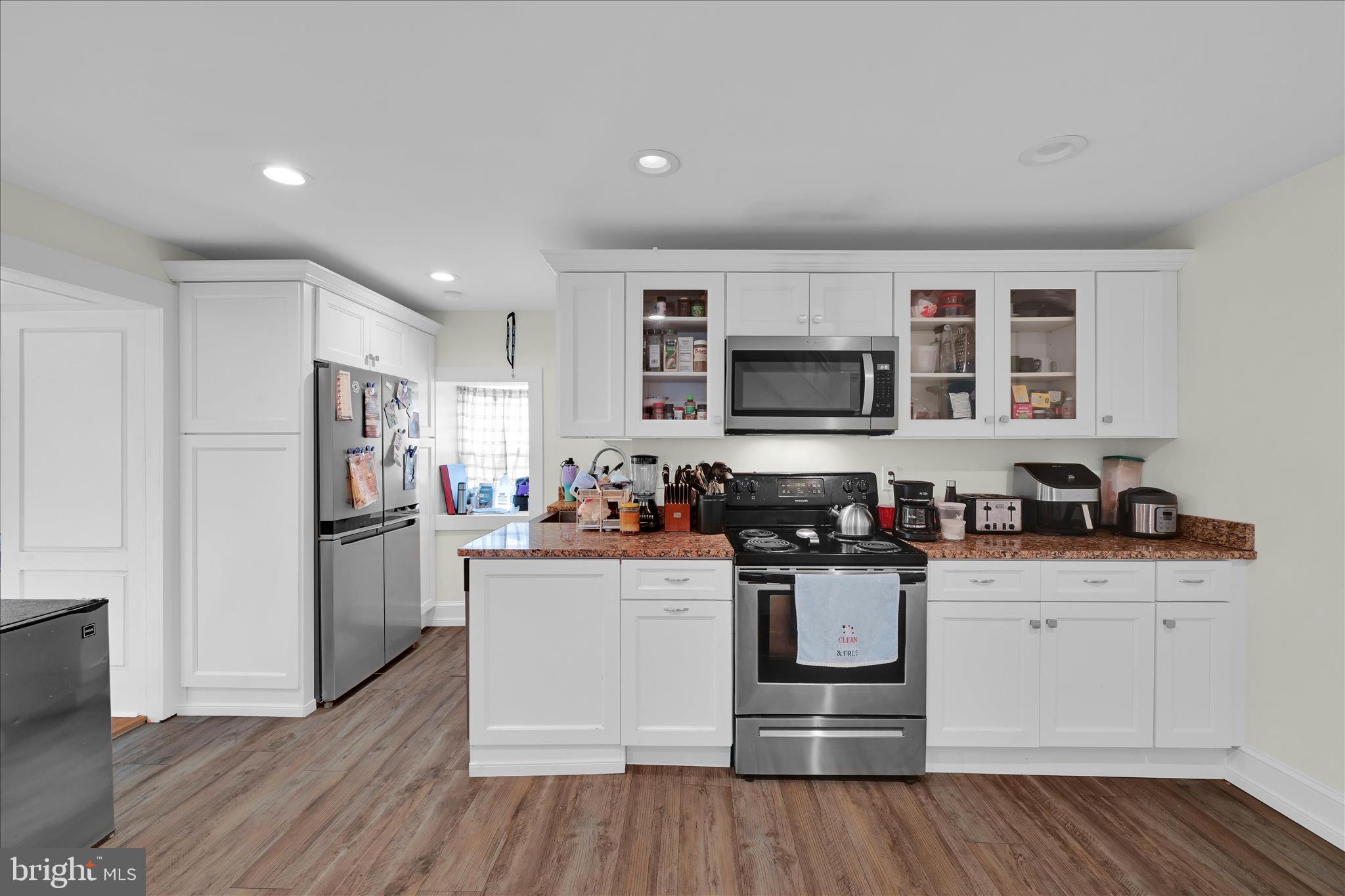 286 Schuylkill Road Birdsboro, PA 19508 - Photo 15 of 39 a kitchen with a refrigerator stove and wooden cabinets