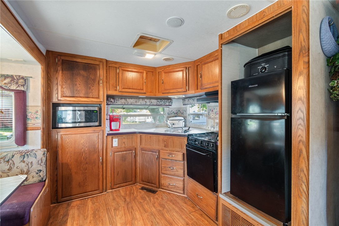 7945 Lake Road, Unit 16 Sodus, NY 14555 - Photo 11 of 20 The kitchen - there are two 40 gal propane tanks t