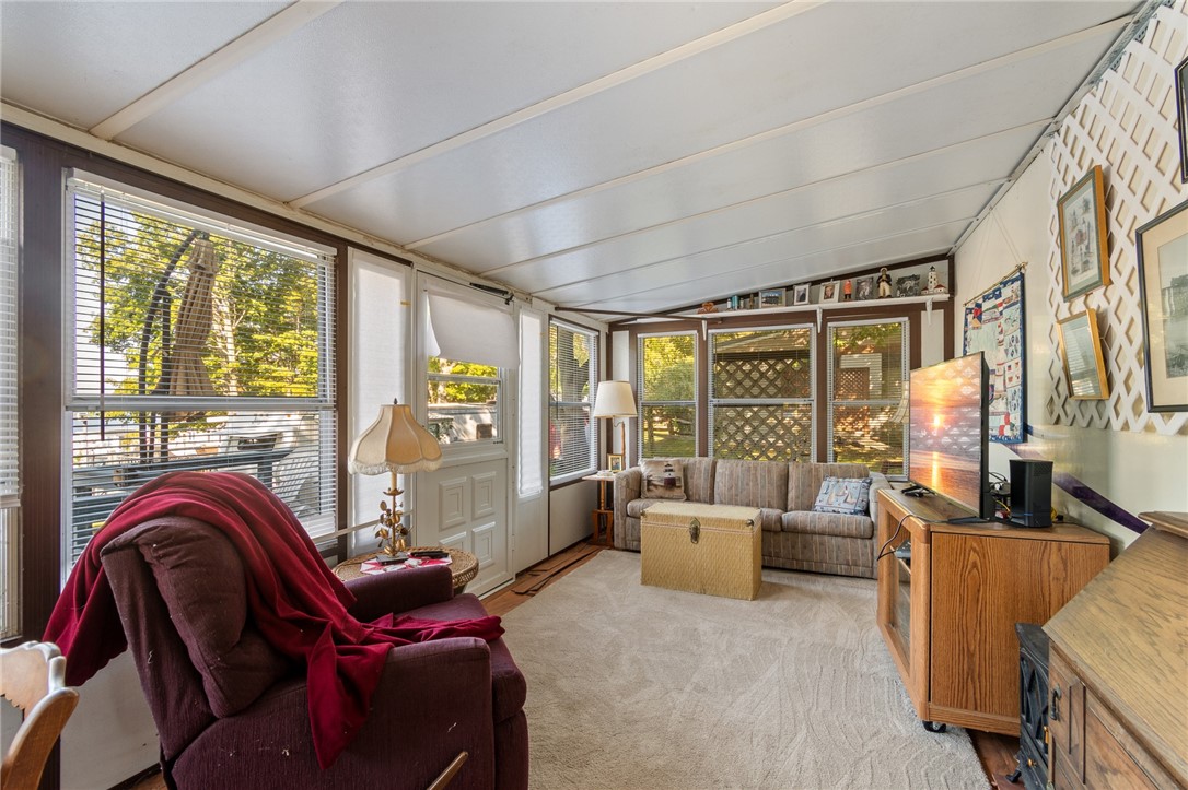 7945 Lake Road, Unit 16 Sodus, NY 14555 - Photo 9 of 20 The roomy and bright ATTACHED FLORIDA ROOM