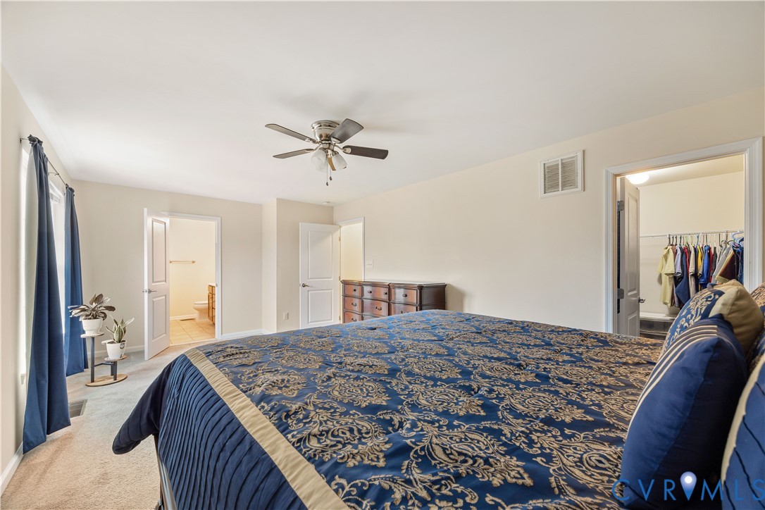 1916 River Ridge Place Hopewell, VA 23860 - Photo 7 of 23 The primary bedroom is spacious and offers a ceili
