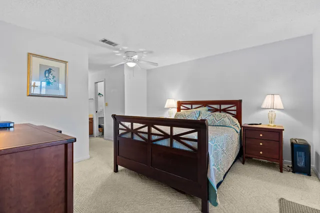 a bedroom with a bed and a table in it