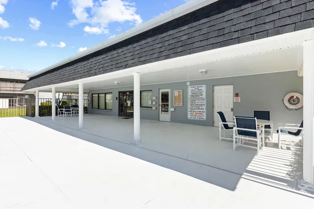 a lobby with furniture and window