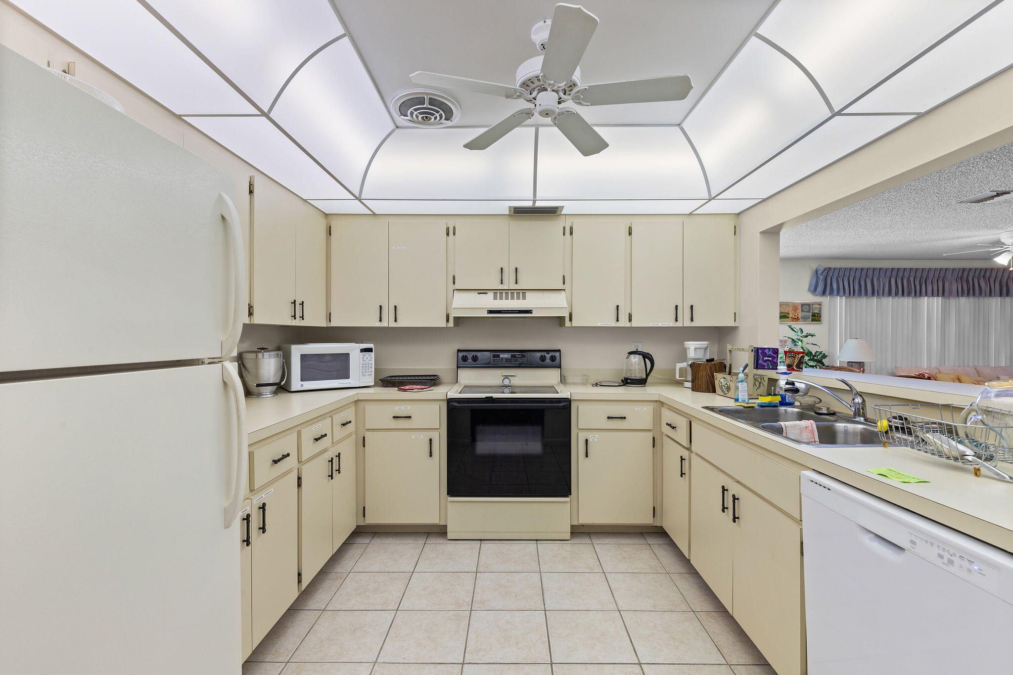 3799 South Banana River Boulevard, Unit 512 Cocoa Beach, FL 32931 - Photo 29 of 34 a kitchen with stainless steel appliances granite countertop a sink and cabinets