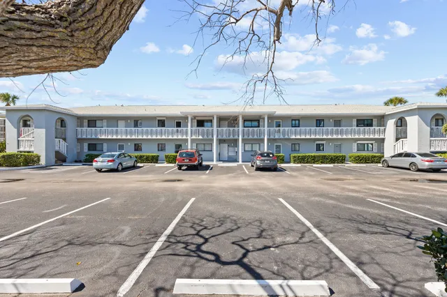a view of a swimming pool with a table and chairs