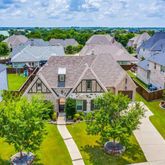 an aerial view of a house with a garden and plants