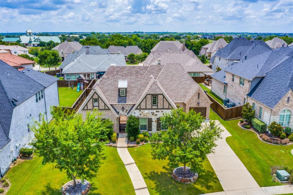 an aerial view of a house with a garden and plants