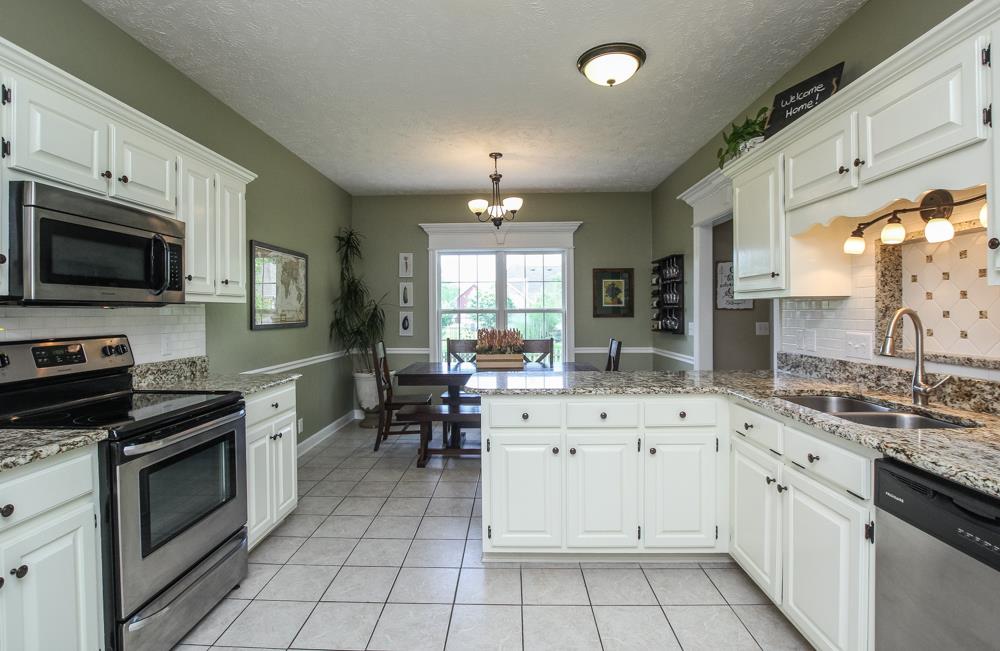 210 Black Bear Trail Murfreesboro, TN 37127 - Photo 10 of 27 a kitchen with a sink stove and microwave