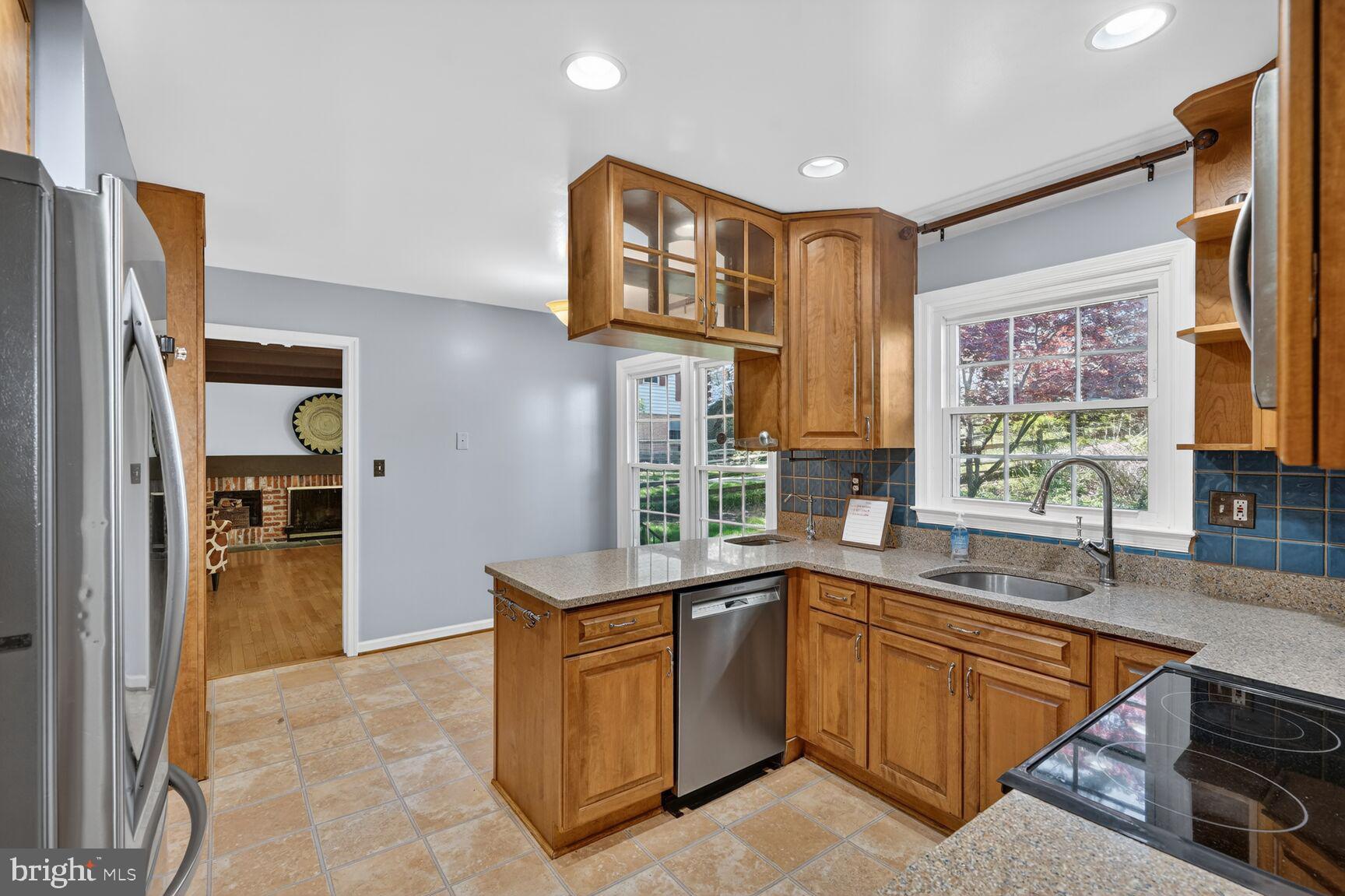 20080 Doolittle Street Gaithersburg, MD 20886 - Photo 11 of 48 a kitchen with a sink stove and refrigerator