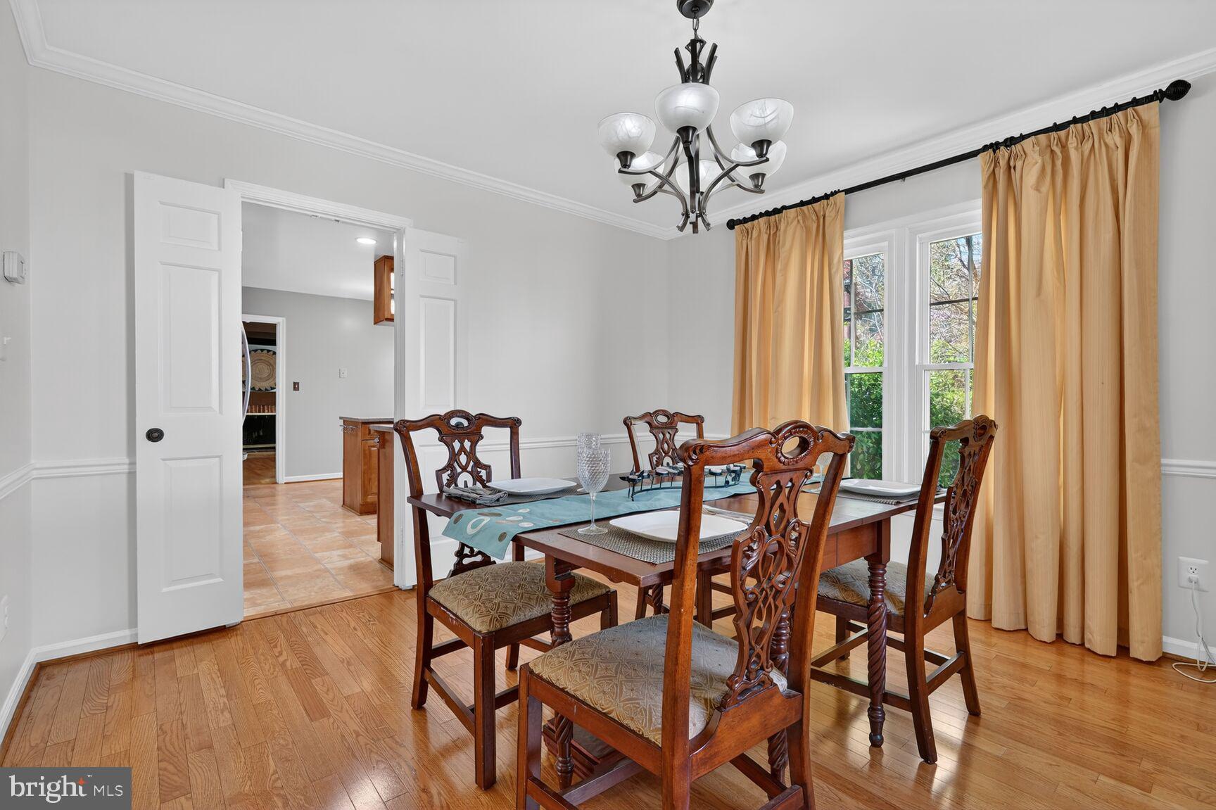 20080 Doolittle Street Gaithersburg, MD 20886 - Photo 13 of 48 a view of a dining room with furniture window and wooden floor