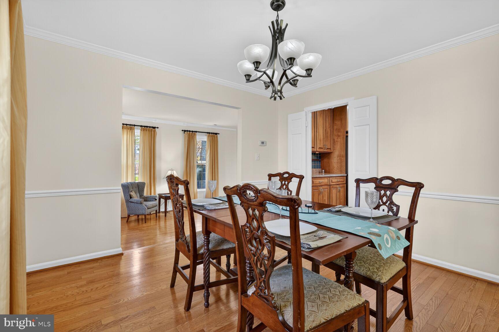 20080 Doolittle Street Gaithersburg, MD 20886 - Photo 14 of 48 a view of a dining room with furniture and wooden floor