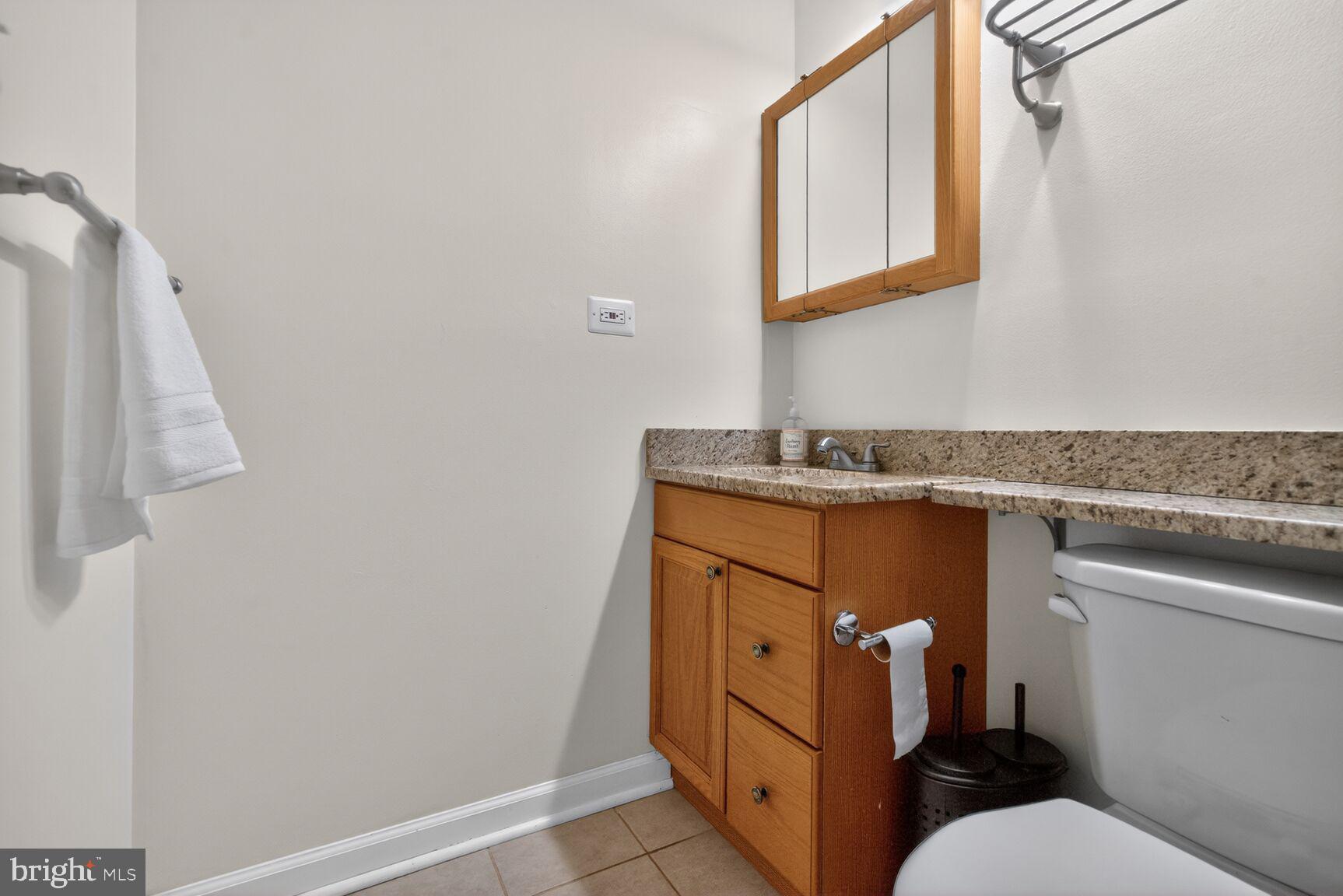20080 Doolittle Street Gaithersburg, MD 20886 - Photo 23 of 48 a bathroom with a sink and mirror