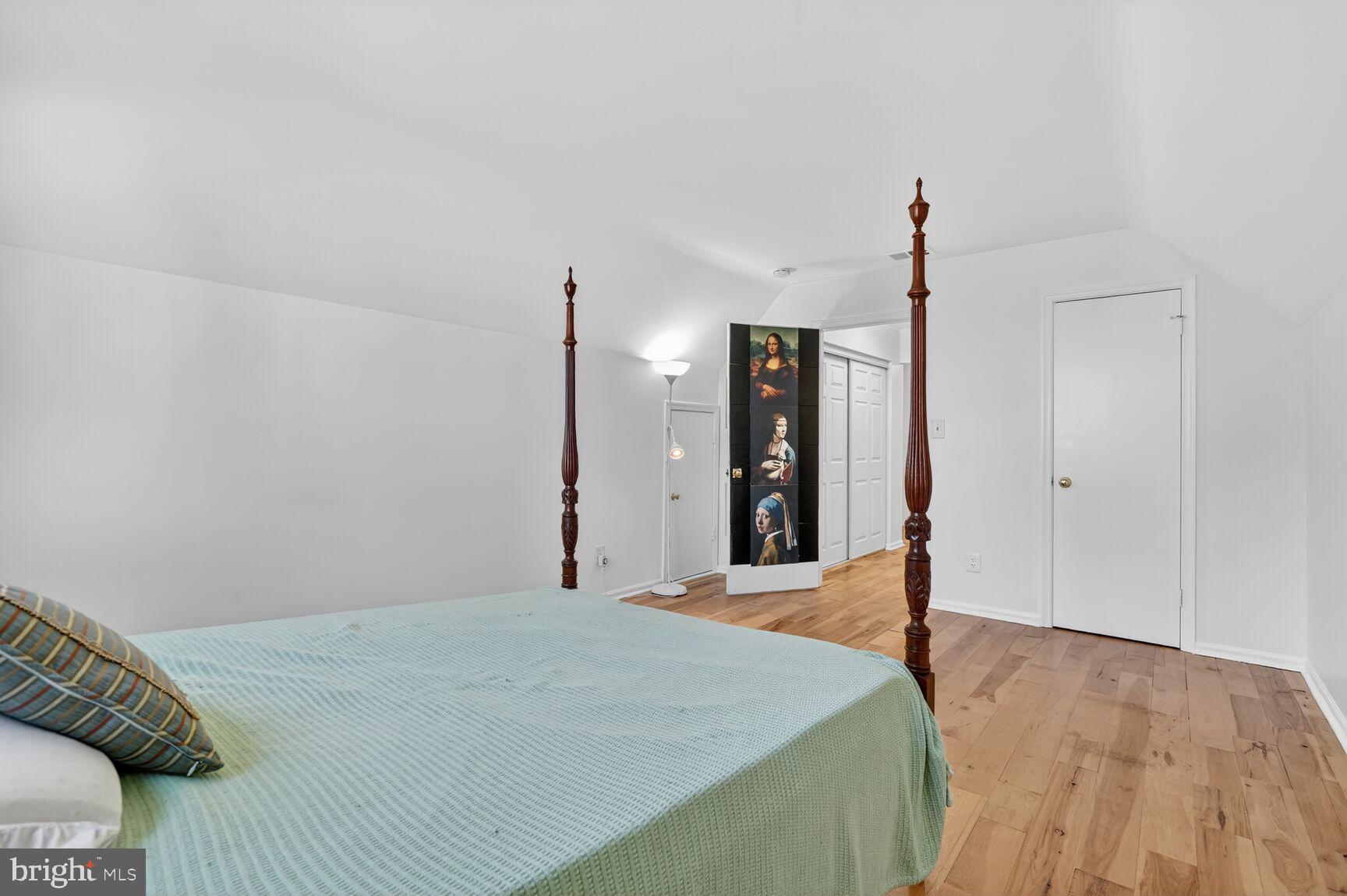 20080 Doolittle Street Gaithersburg, MD 20886 - Photo 25 of 48 a bed room with a bed and a ceiling fan