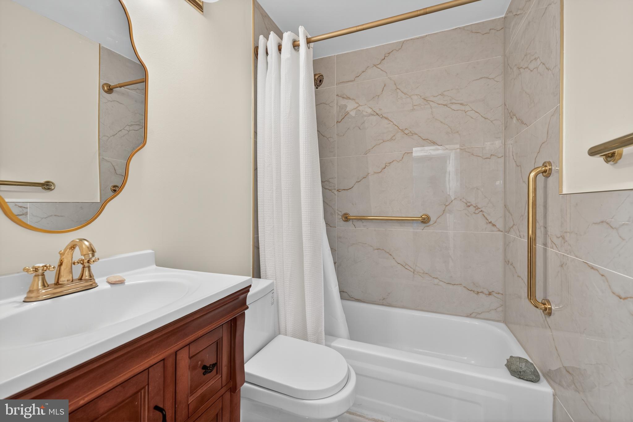 20080 Doolittle Street Gaithersburg, MD 20886 - Photo 27 of 48 a bathroom with a sink toilet and shower