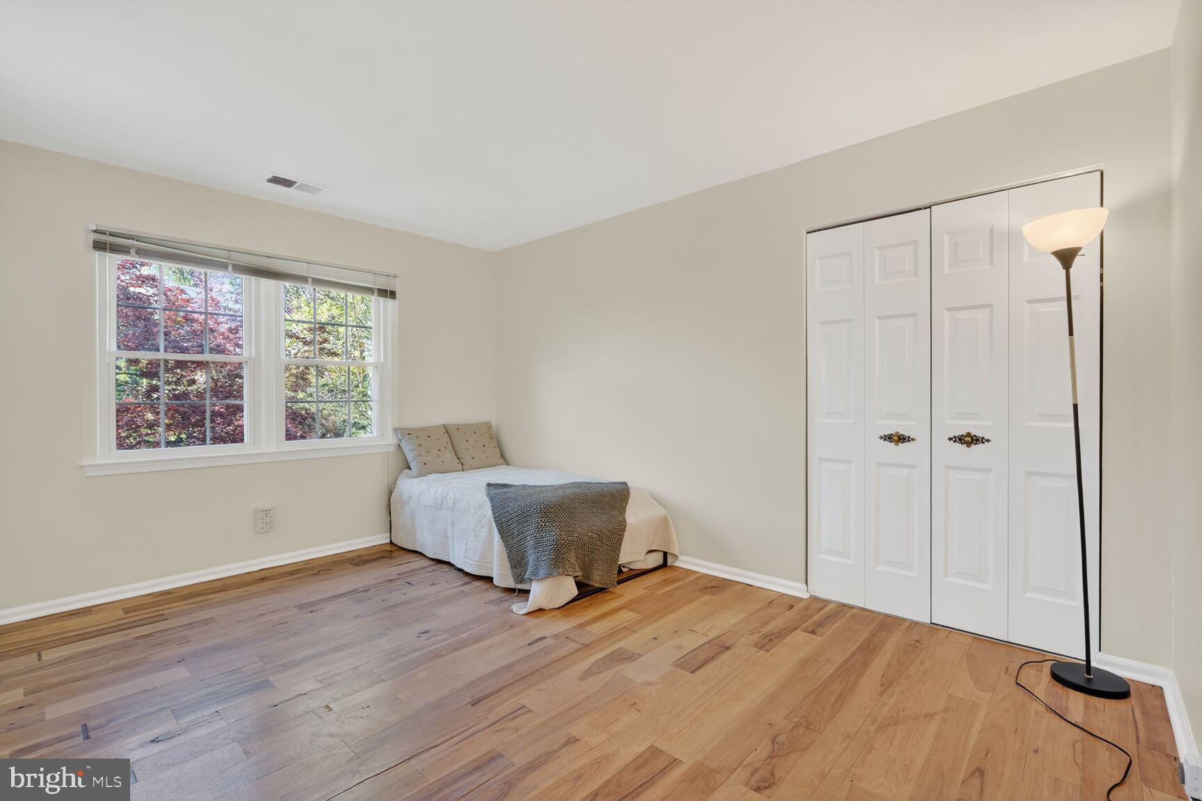 20080 Doolittle Street Gaithersburg, MD 20886 - Photo 30 of 48 a bedroom with a bed and a window