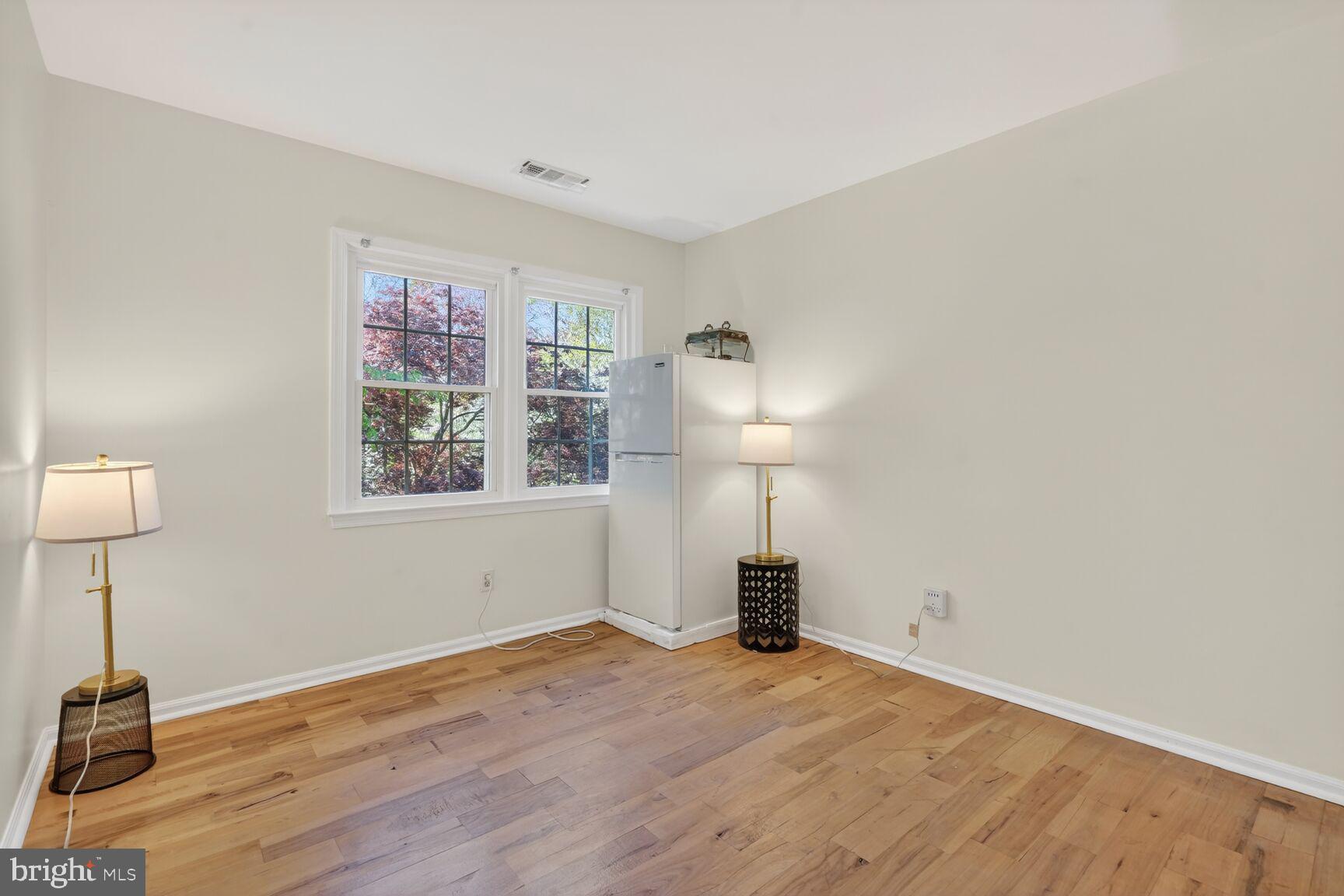 20080 Doolittle Street Gaithersburg, MD 20886 - Photo 31 of 48 a view of empty room with a window and wooden floor