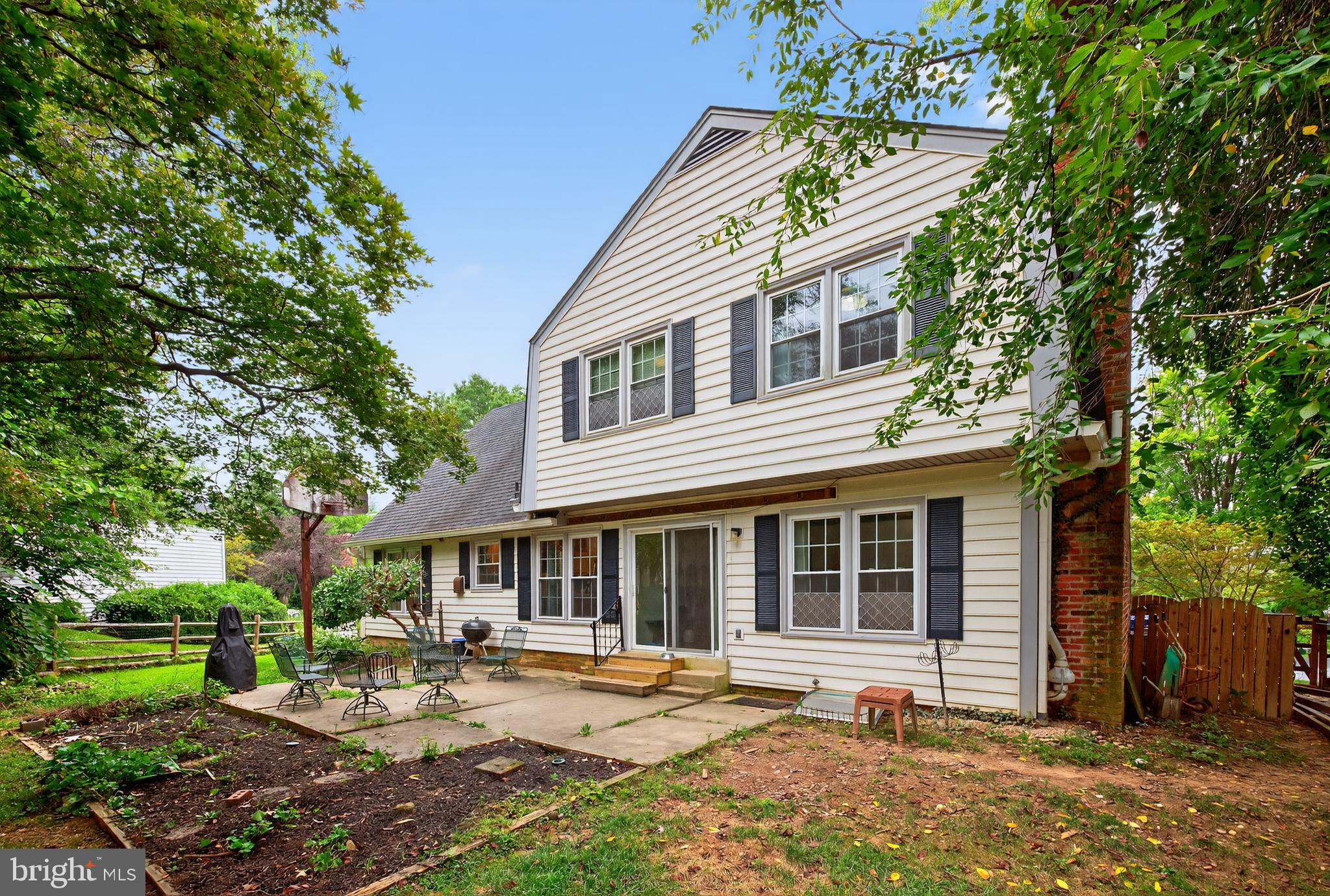 20080 Doolittle Street Gaithersburg, MD 20886 - Photo 40 of 48 a front view of a house with a garden