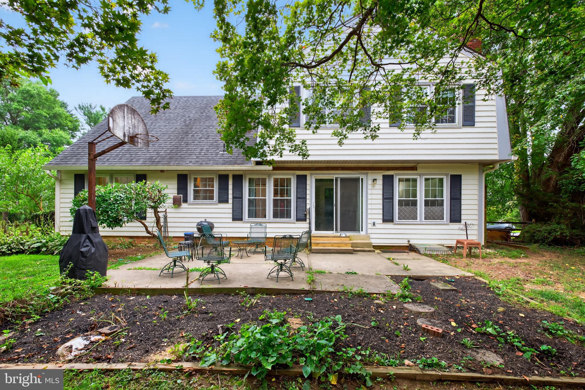 20080 Doolittle Street Gaithersburg, MD 20886 - Photo 41 of 48 a view of a house with a sitting area and garden