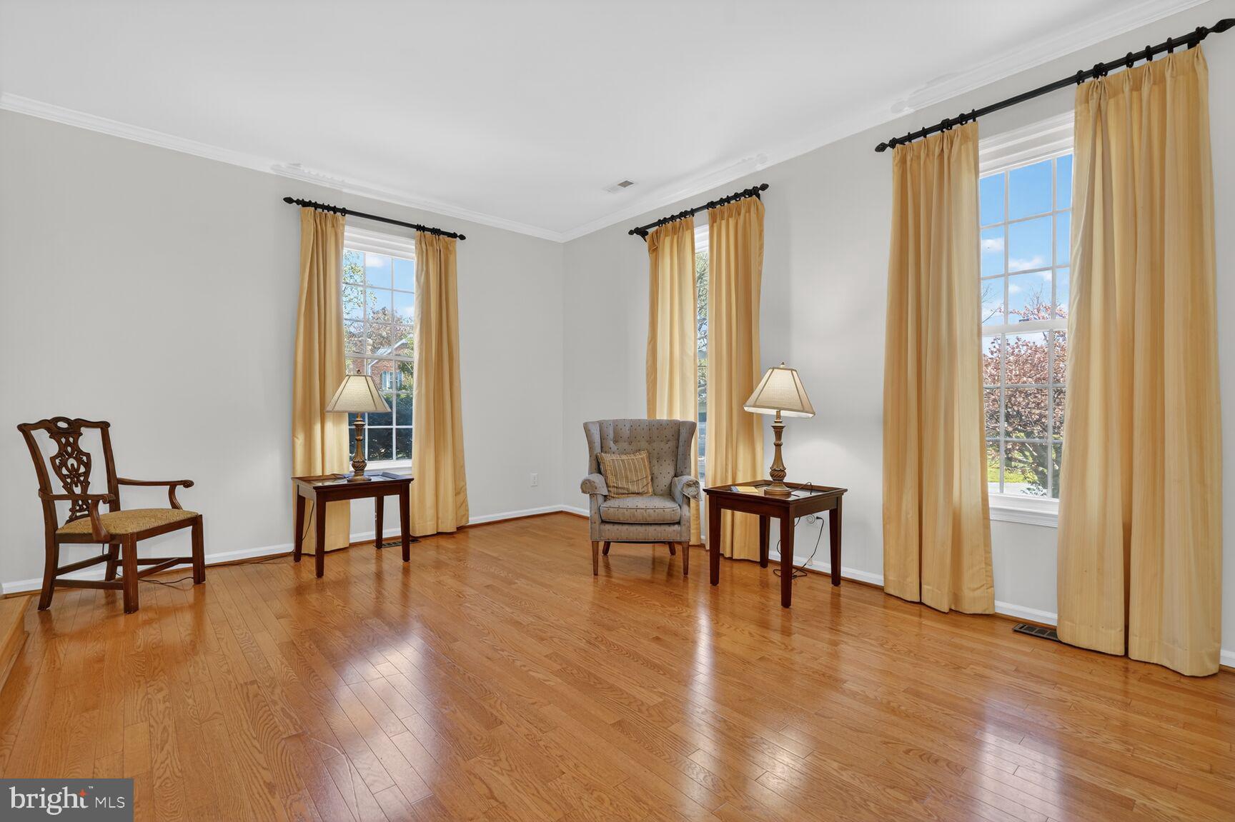 20080 Doolittle Street Gaithersburg, MD 20886 - Photo 5 of 48 a living room with furniture and a table next to a window