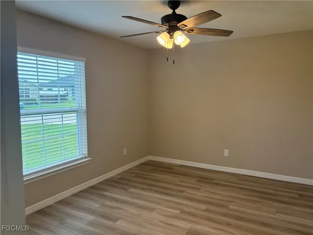 a view of sitting area in back of a house