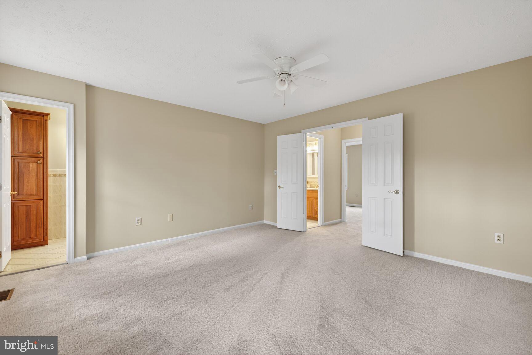 2306 Eagle Rock Place Silver Spring, MD 20906 - Photo 12 of 30 Custom built-in closet shelves and neutral carpet