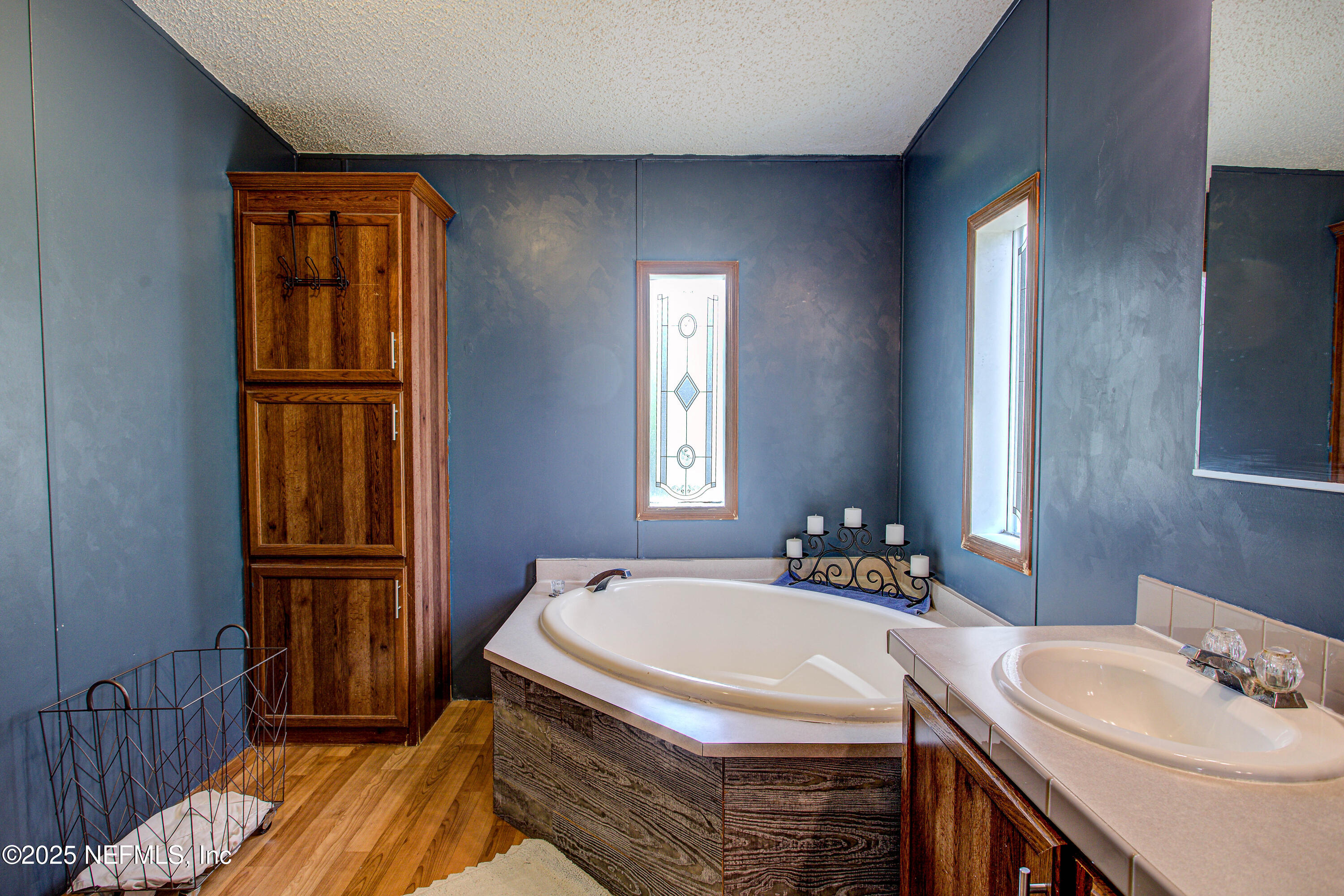 7630 Oak Forest Road Keystone Heights, FL 32656 - Photo 38 of 70 a bathroom with a sink and a mirror