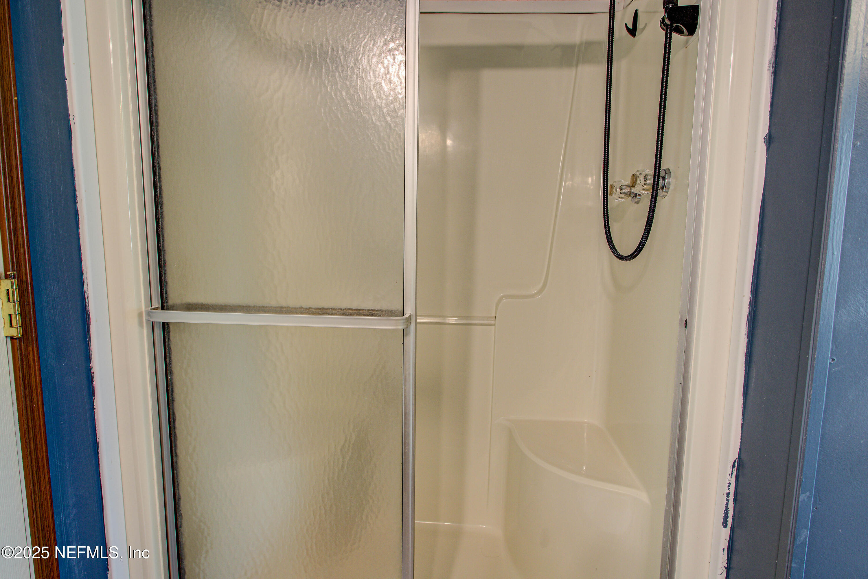 7630 Oak Forest Road Keystone Heights, FL 32656 - Photo 40 of 70 a bathroom with a glass shower door