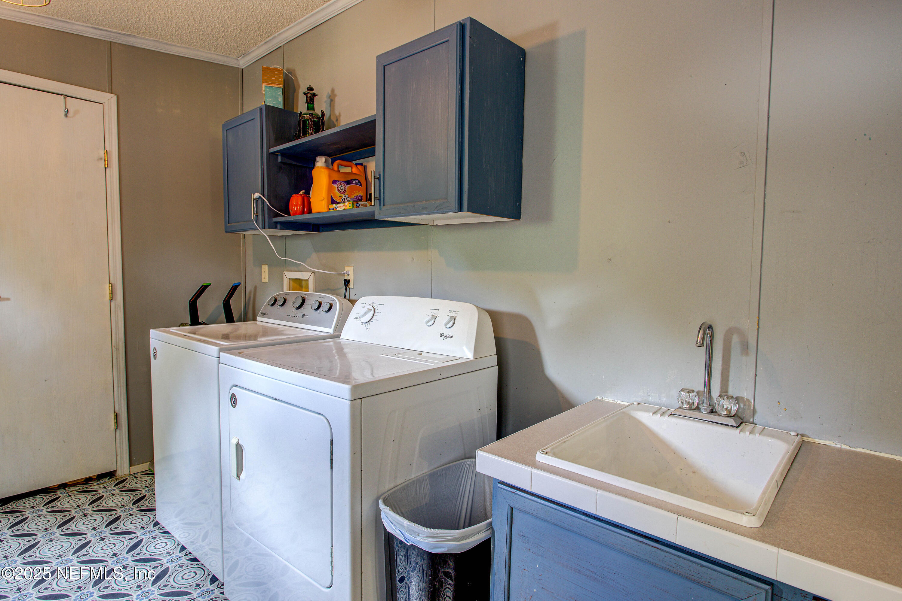 7630 Oak Forest Road Keystone Heights, FL 32656 - Photo 46 of 70 a room with a sink and a toilet