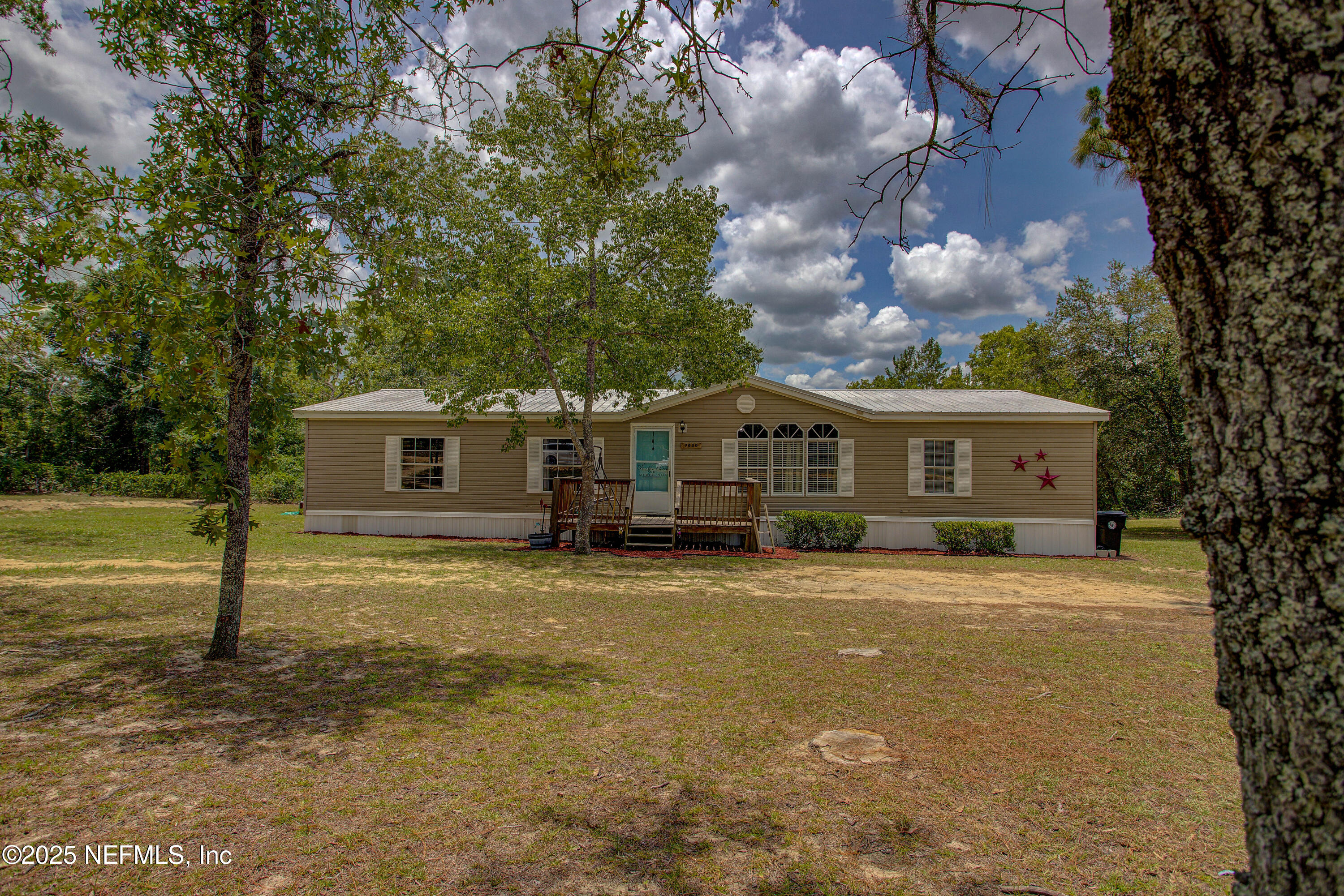 7630 Oak Forest Road Keystone Heights, FL 32656 - Photo 55 of 70 a front view of a house with a yard