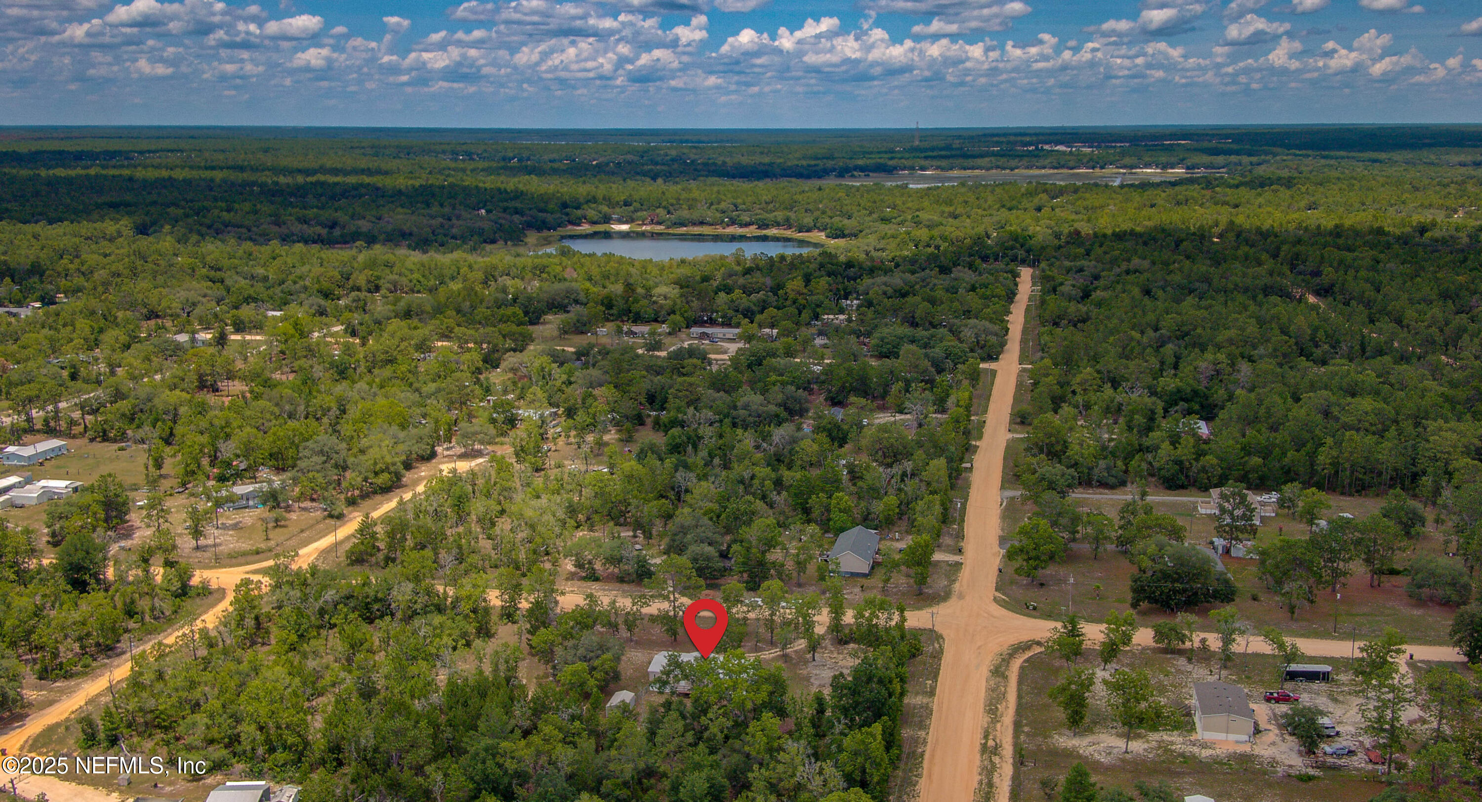 7630 Oak Forest Road Keystone Heights, FL 32656 - Photo 60 of 70 a view of a garden with a lake