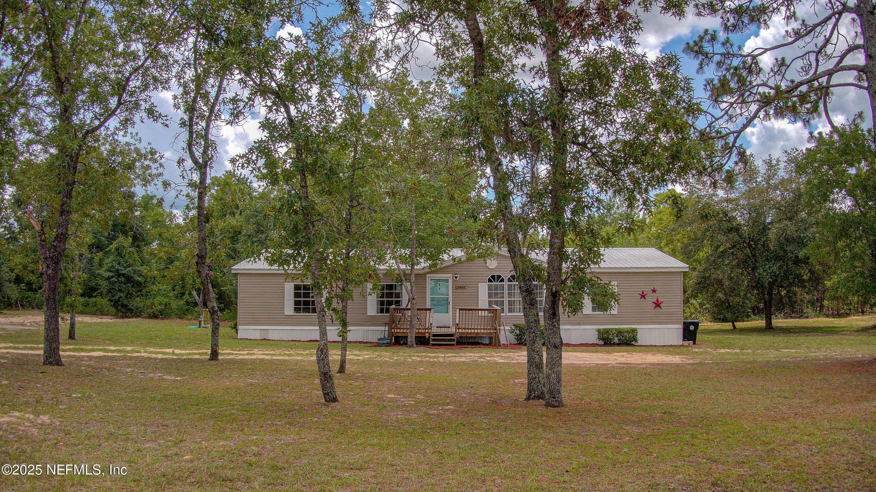 7630 Oak Forest Road Keystone Heights, FL 32656 - Photo 70 of 70 a front view of a house with a garden