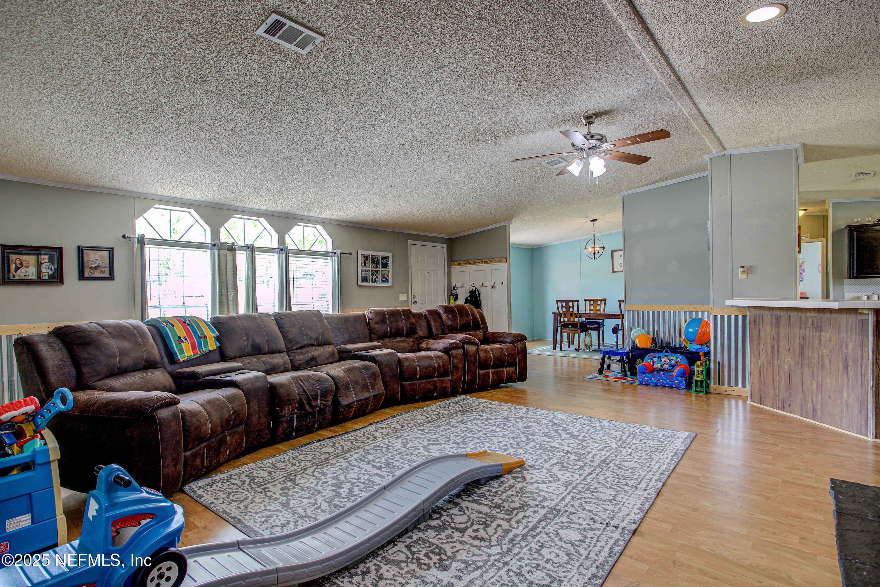 7630 Oak Forest Road Keystone Heights, FL 32656 - Photo 9 of 70 a living room with furniture and a wooden floor