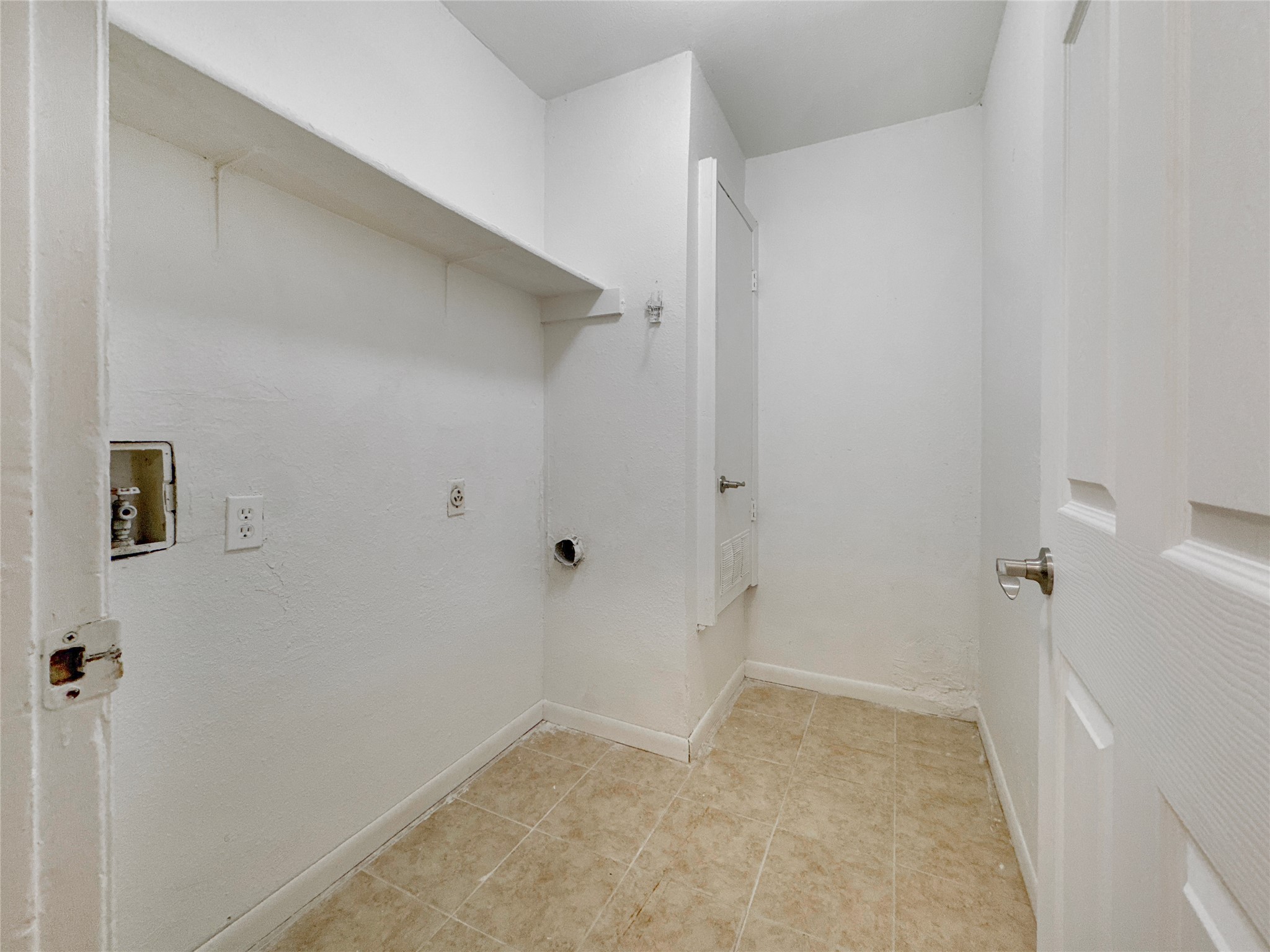 2017 Greenbrook Parkway, Unit B Austin, TX 78723 - Photo 12 of 14 Laundry area with hookup for a washing machine and baseboards