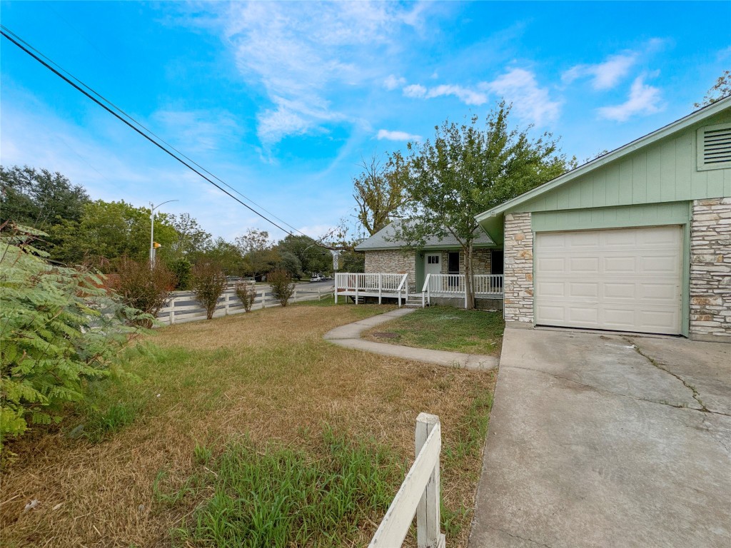 2017 Greenbrook Parkway, Unit B Austin, TX 78723 - Photo 2 of 14 a view of a white house with a big yard and large tree