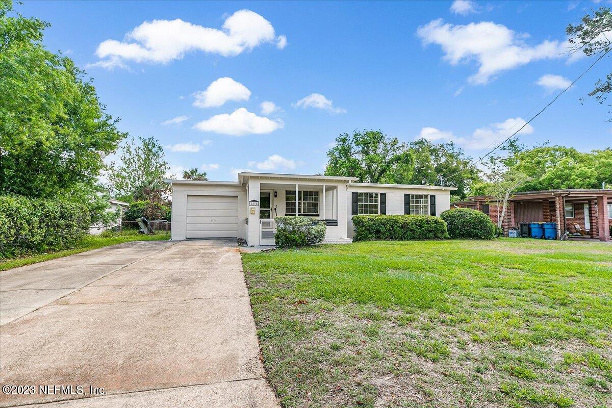 2435 Evernia Road Jacksonville, FL 32211 - Photo 14 of 15 a view of a house with a yard