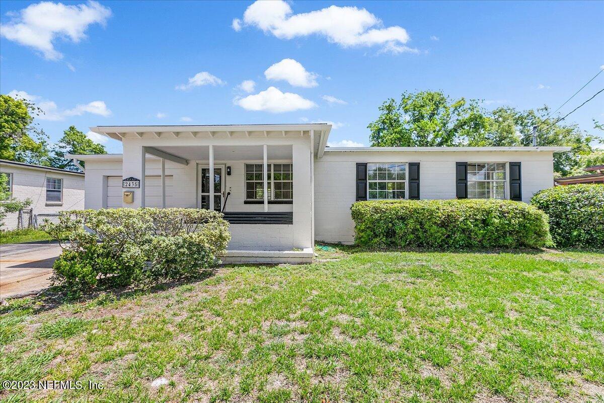 2435 Evernia Road Jacksonville, FL 32211 - Photo 2 of 15 front view of a house with a yard