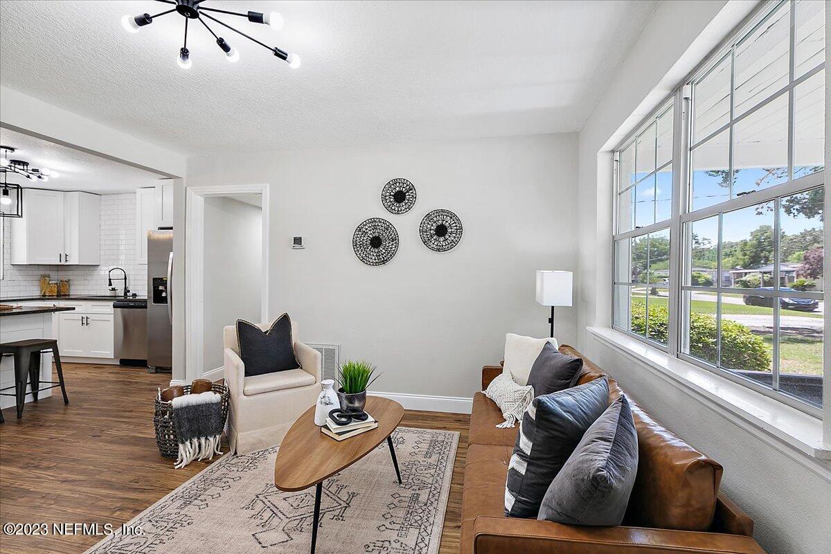2435 Evernia Road Jacksonville, FL 32211 - Photo 5 of 15 a living room with furniture and a large window