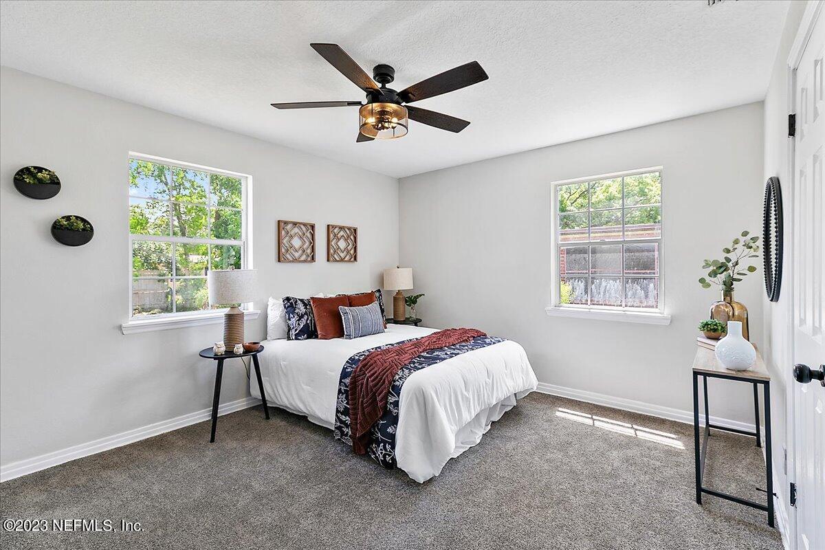 2435 Evernia Road Jacksonville, FL 32211 - Photo 7 of 15 a bed room with a bed and a window