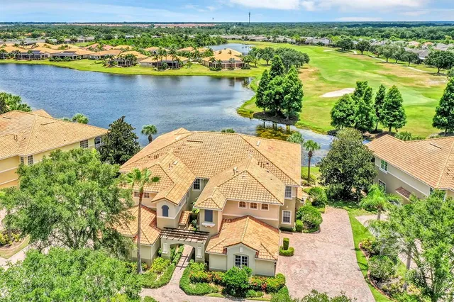an aerial view of ocean with residential house with outdoor space