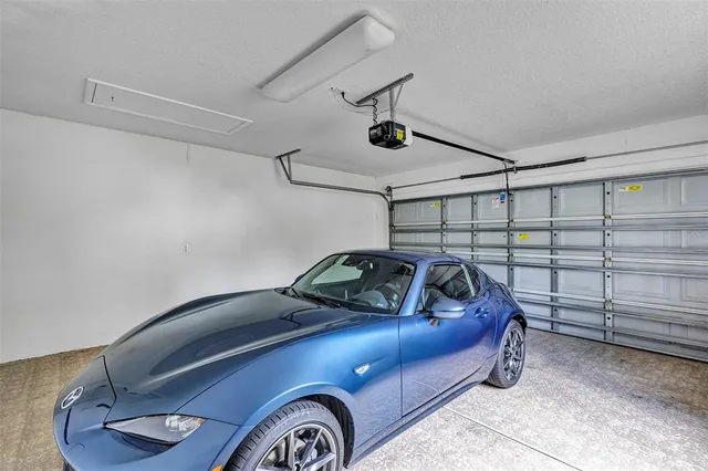 an aerial view of a house with a lake view