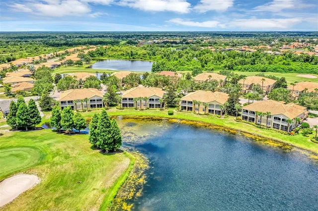 a view of multiple houses with a yard